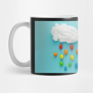 Photo illustration depicting clouds and rainbow-colored raindrops Mug